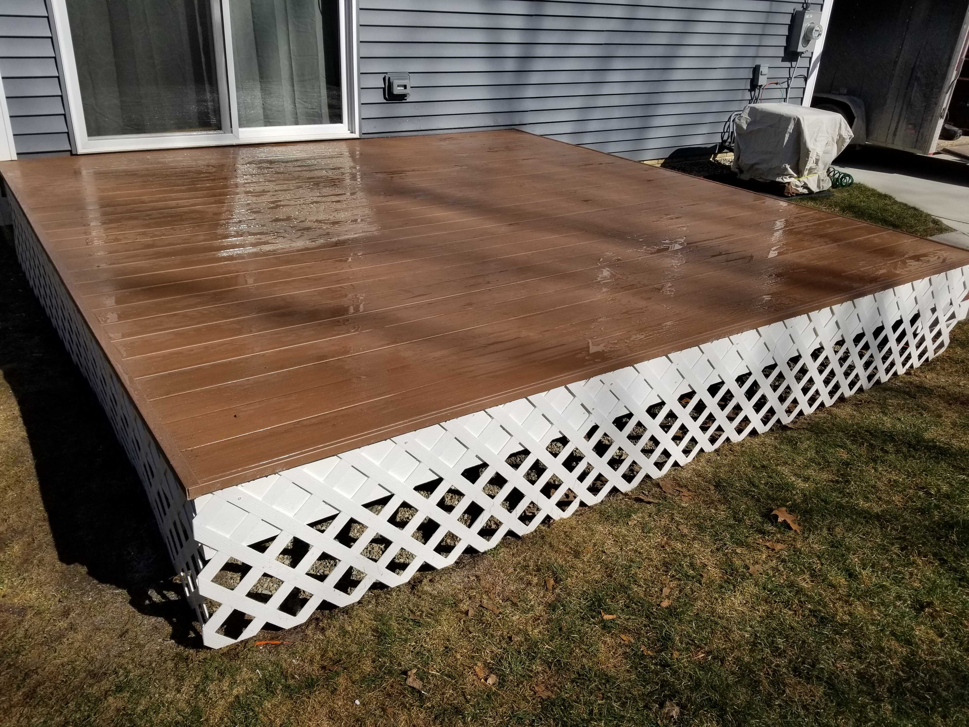 A modern faux-wood exterior deck.