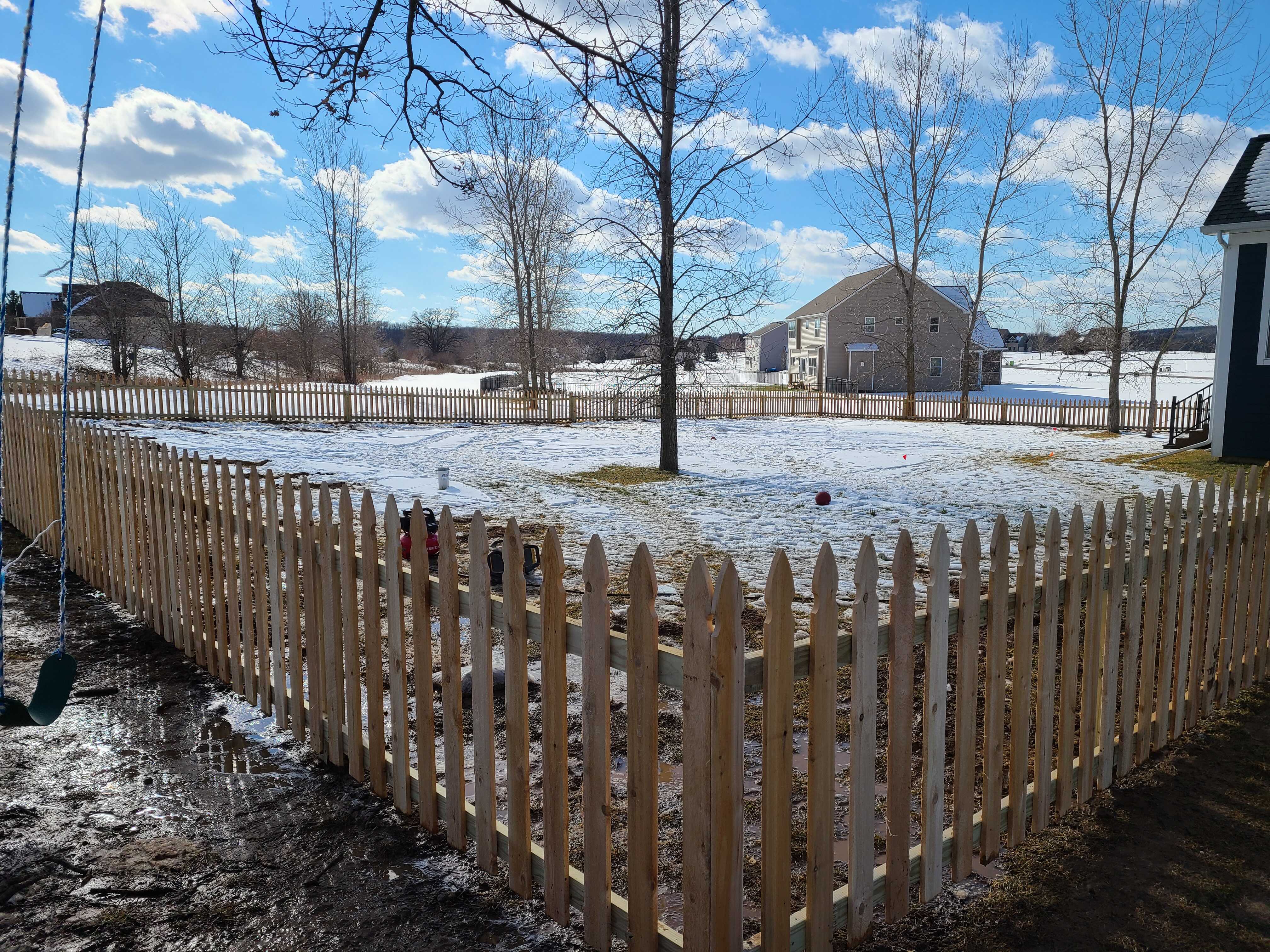 A picket style fence.